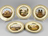quatre plaques ornées de représentations d'un château, d'une église et d'autres bâtiments