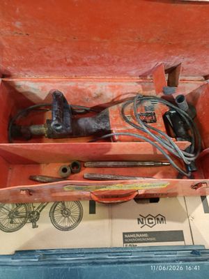 a box with tools in it sitting on a table