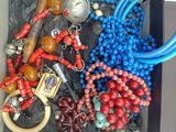 a tray of assorted beads and other items in it