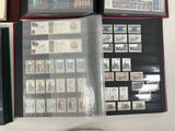 a lot of stamps on the pages of a binder