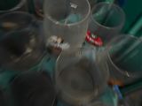 many empty plastic cups and spoons on the table