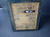 a small wooden box with a metal handle on it