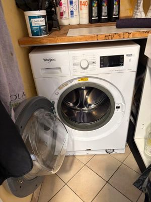 a washer and dryer in a small room