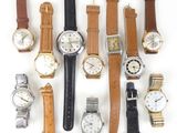 a lot of watches that are sitting together on the table