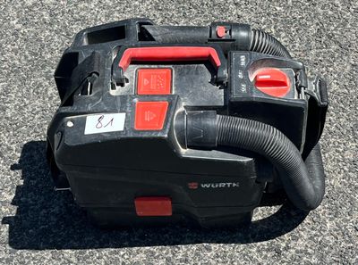 a black and red blower sitting on the ground