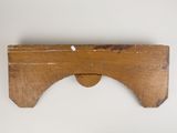 an image of a wooden shelf with a piece of wood sticking out of it