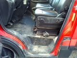 an image of a car with a suitcase in the back seat