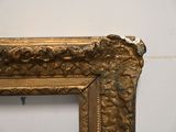 a picture of a picture of a gold frame on the wall