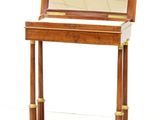 a small wooden desk with a mirror on top of it