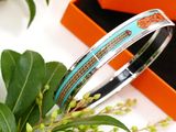 a close up of a bracelet in a box on a table