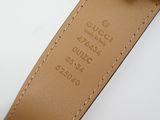 a close up of a brown leather belt with a metal buckle