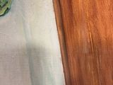 an oil painting of a green frog sitting on top of a wooden board