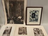 several old black and white photographs are on display in a display case