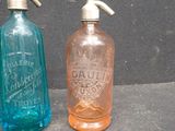 two bottles that are sitting next to each other on a table