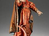 statue of a man in a red robe holding a sword