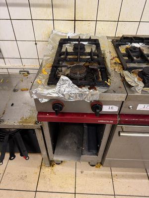 two burners on the stove in the kitchen