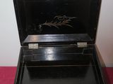 a small wooden box with a horse on it
