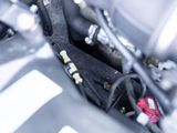 a close up view of a car engine with its hood open