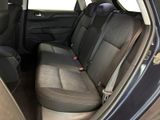 the back seats of a car are empty with no one in it