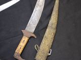 two different types of knives on a black cloth