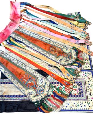 a lot of ties that are laying on a table