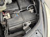 the engine compartment of a car with the hood open