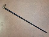 a long stick that is laying on the floor