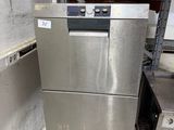 an image of a stainless steel dishwasher in a warehouse
