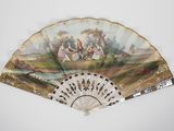 an old fan with a painting on it sitting on top of a table