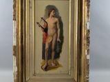 une vieille photo d'un homme nu avec une guitare, dans un cadre doré