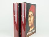 two books with a picture of a man in a red hat