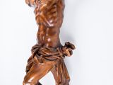 a statue of jesus hanging on the wall
