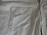 a close up of a shirt with a pocket on it