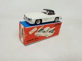 an image of a white toy car sitting on top of a box