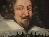 portrait of a man with a beard and a white collar
