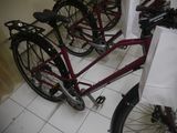many bikes that are parked in a row on the floor