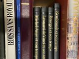 many books that are on a shelf together
