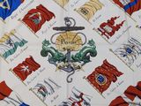 a close up of a table cloth with flags and a cross on it