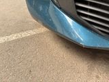 a close up of a car ' s front grill and front bumper