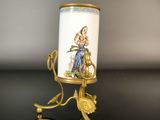 an image of a candle holder with a picture of a woman on it