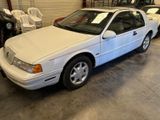a white car that is parked in a garage