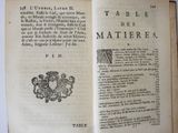 an open book with a picture of a coat of arms on it