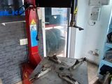 a red machine that is sitting in the corner of a room