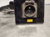 a black electrical outlet with a yellow tag on it