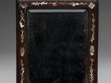 an old wooden box with a mirror on top of it