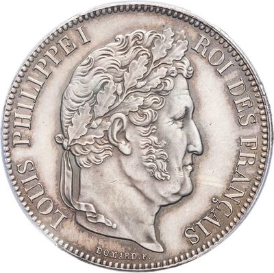a close up of a coin with a man ' s face on it