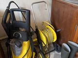 a yellow and black vacuum and a black and white checkered floor