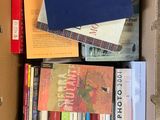 a box full of books that are sitting on the floor