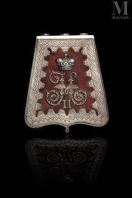 an antique silver and red purse with a crown on it