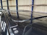 an image of a black car in a garage